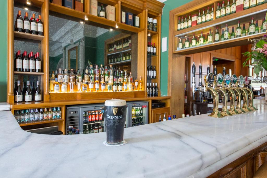 a bar filled with lots of bottles of alcohol at Portmarnock Resort & Jameson Golf Links in Portmarnock