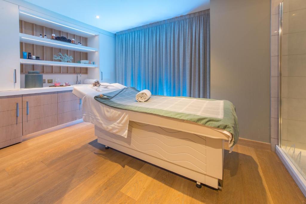 a hospital room with a bed and a window at Portmarnock Resort & Jameson Golf Links in Portmarnock