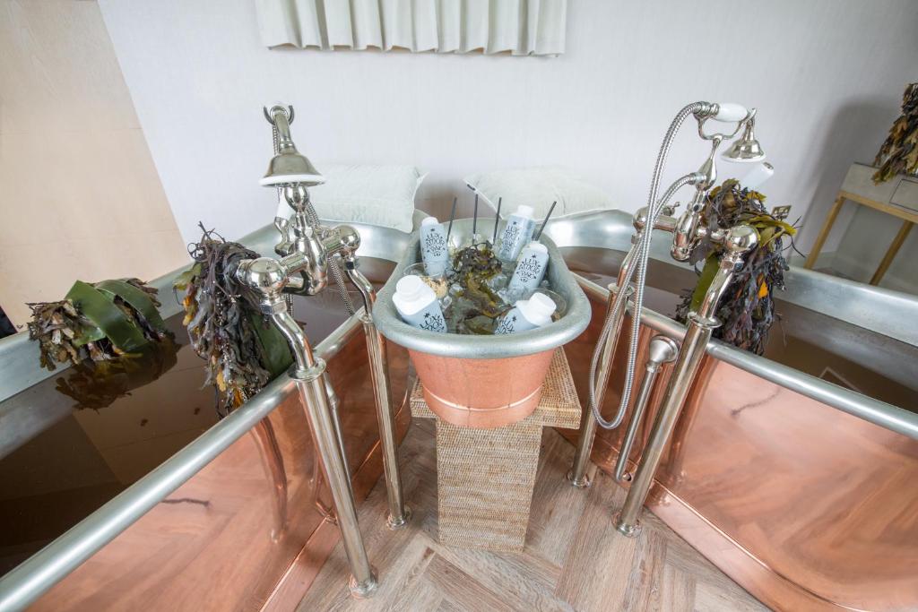 a bathroom with a sink in a room at Portmarnock Resort & Jameson Golf Links in Portmarnock