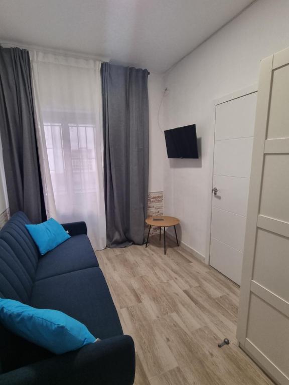 Svetainės erdvė apgyvendinimo įstaigoje Apartamentos Alicante