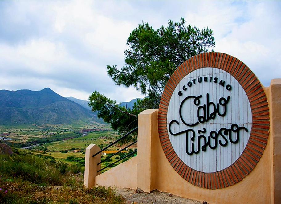 a sign for a chocoocooco sign on a hill at Ecoturismo Cabo Tiñoso in Murcia