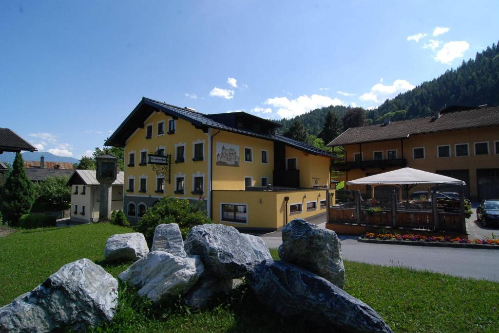 a group of rocks in front of a building at Werfenerhof in Werfen