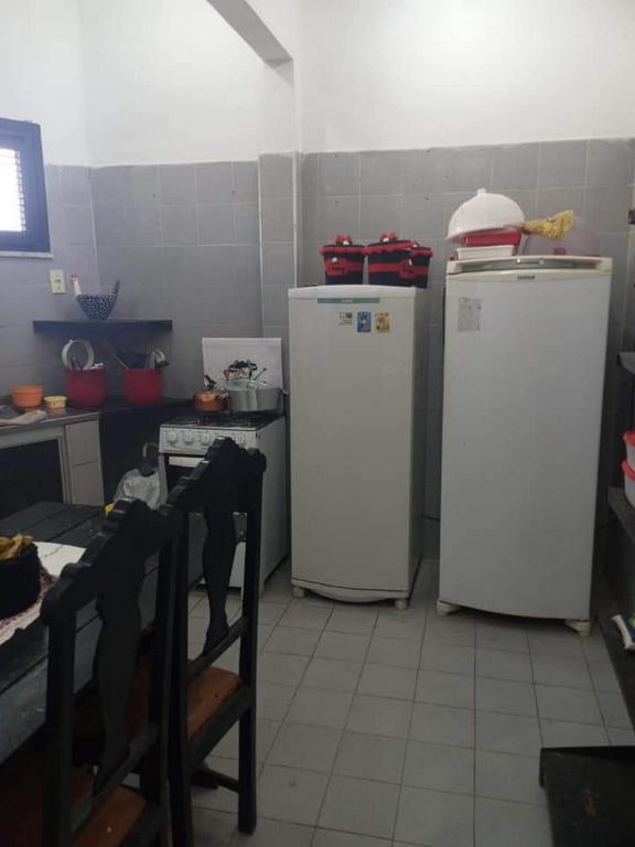 Kuchyň nebo kuchyňský kout v ubytování Pousada e Hostel Lua de Tomate