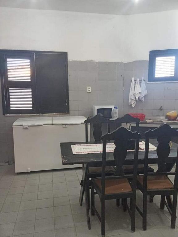 Kuchyň nebo kuchyňský kout v ubytování Pousada e Hostel Lua de Tomate