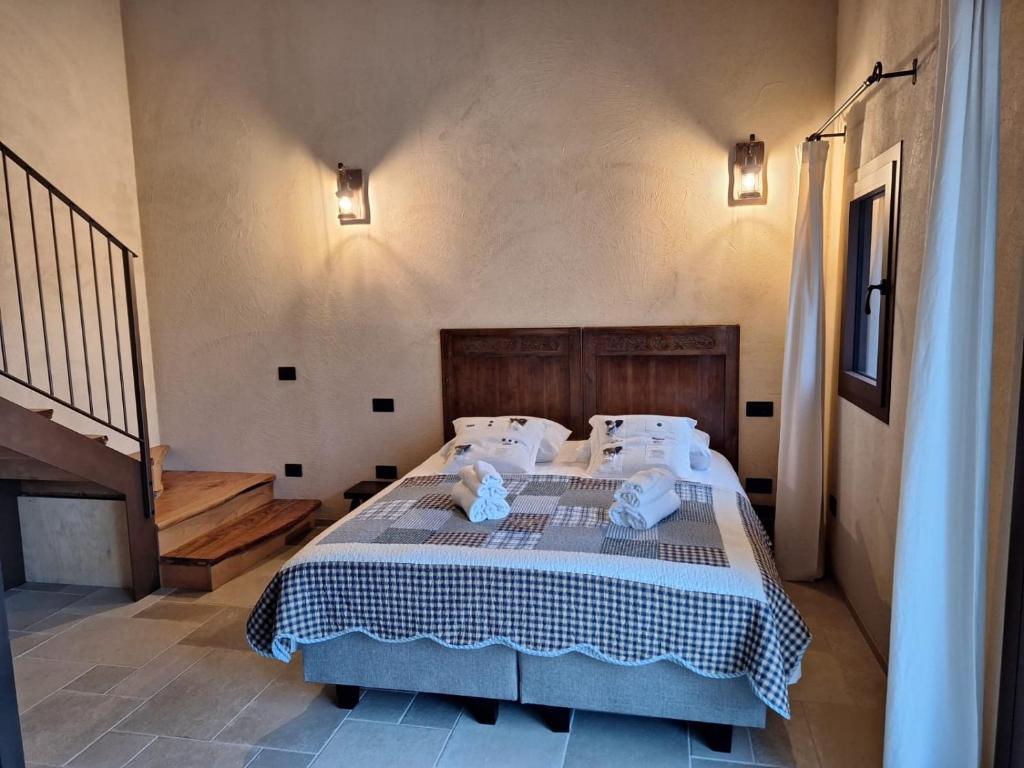Postel nebo postele na pokoji v ubytování Agriturismo La Pina