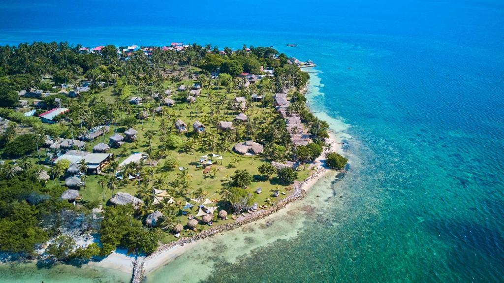 an aerial view of an island in the ocean at Hotel Isla Mucura in Isla Mucura