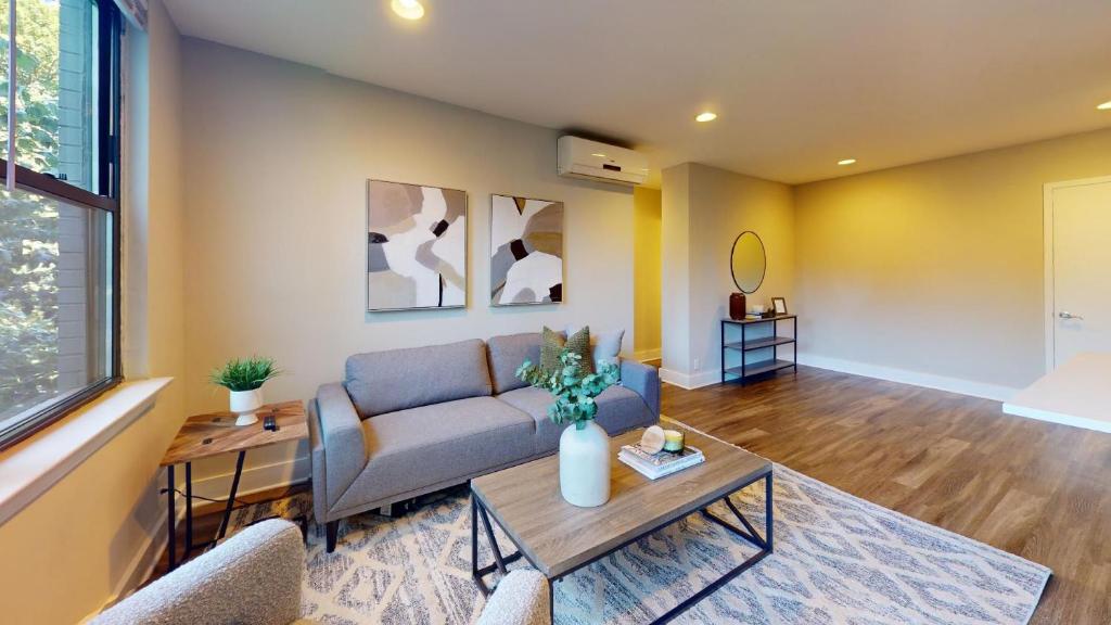 a living room with a couch and a table at Avenue B234 2bedroom With Pool, Gym, Parking in Philadelphia
