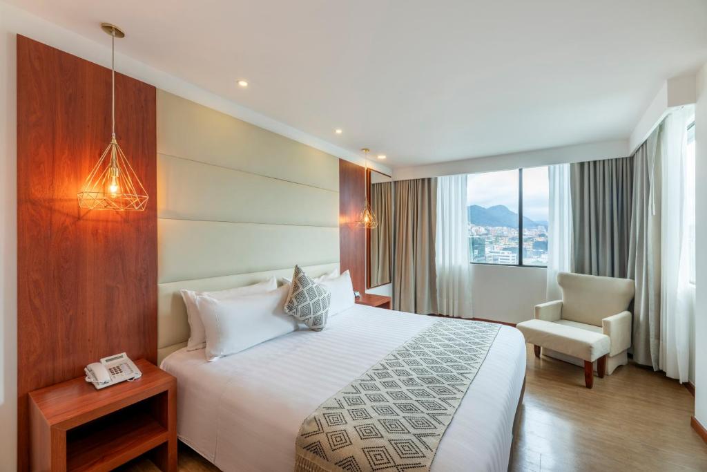 Postel nebo postele na pokoji v ubytování Hotel Andes Plaza