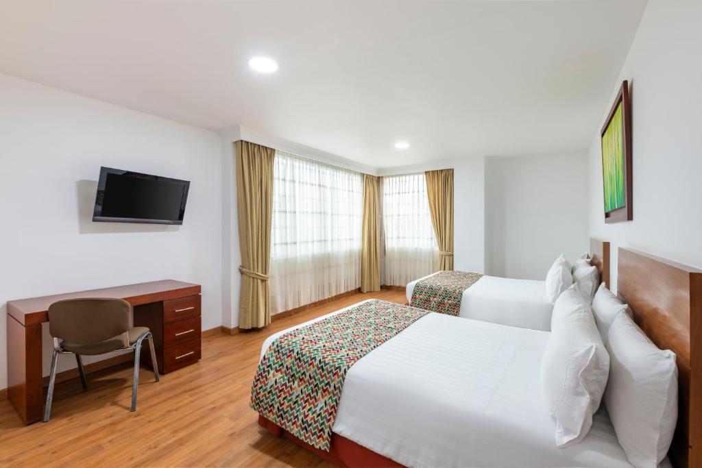 Postel nebo postele na pokoji v ubytování Hotel Andes Plaza