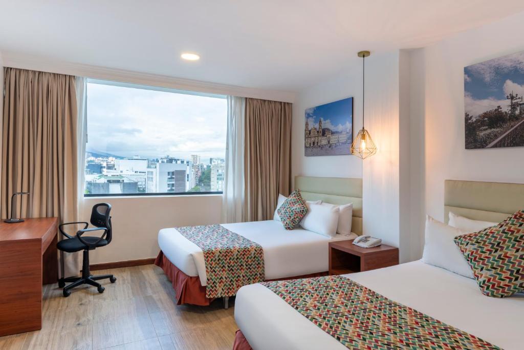 Postel nebo postele na pokoji v ubytování Hotel Andes Plaza