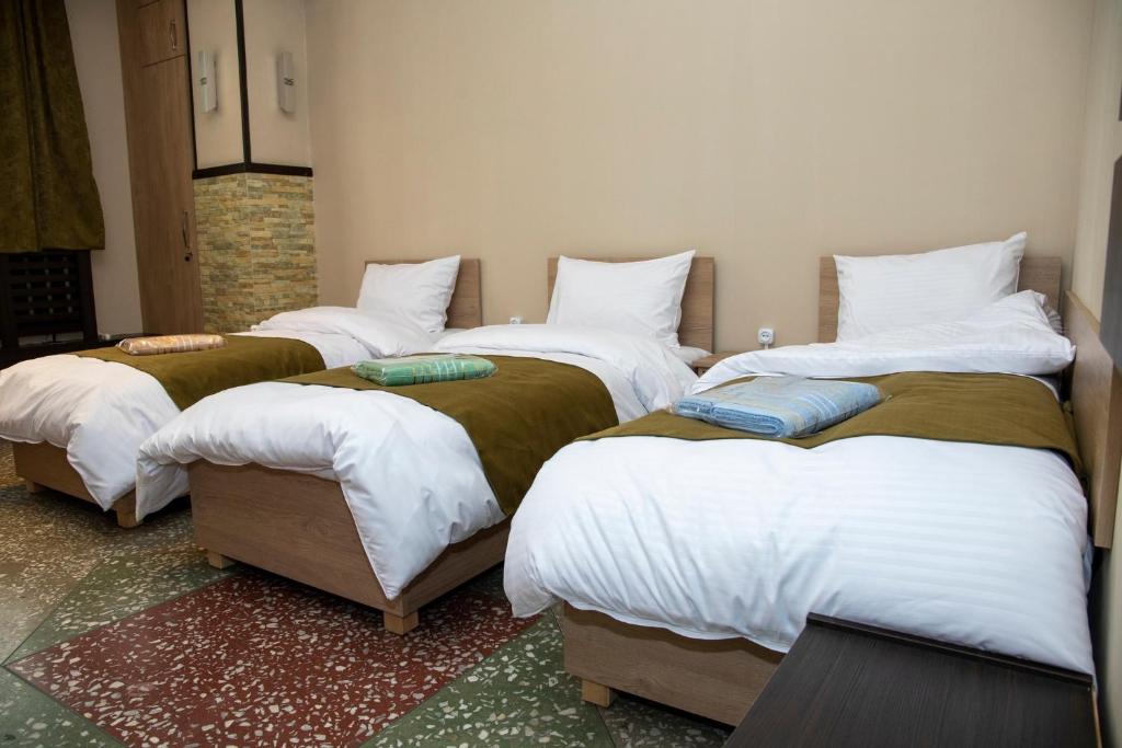 Postel nebo postele na pokoji v ubytování ASA Hotel