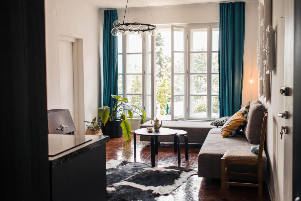 a living room with a couch and a table at Villa Mavro Mavrovo in Mavrovo