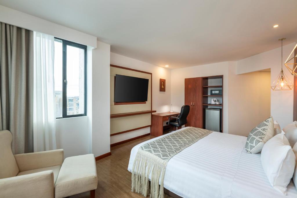 Postel nebo postele na pokoji v ubytování Hotel Andes Plaza