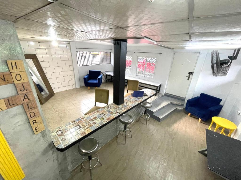 an overhead view of a room with chairs and a counter at OyeBonita Hostel in Panama City