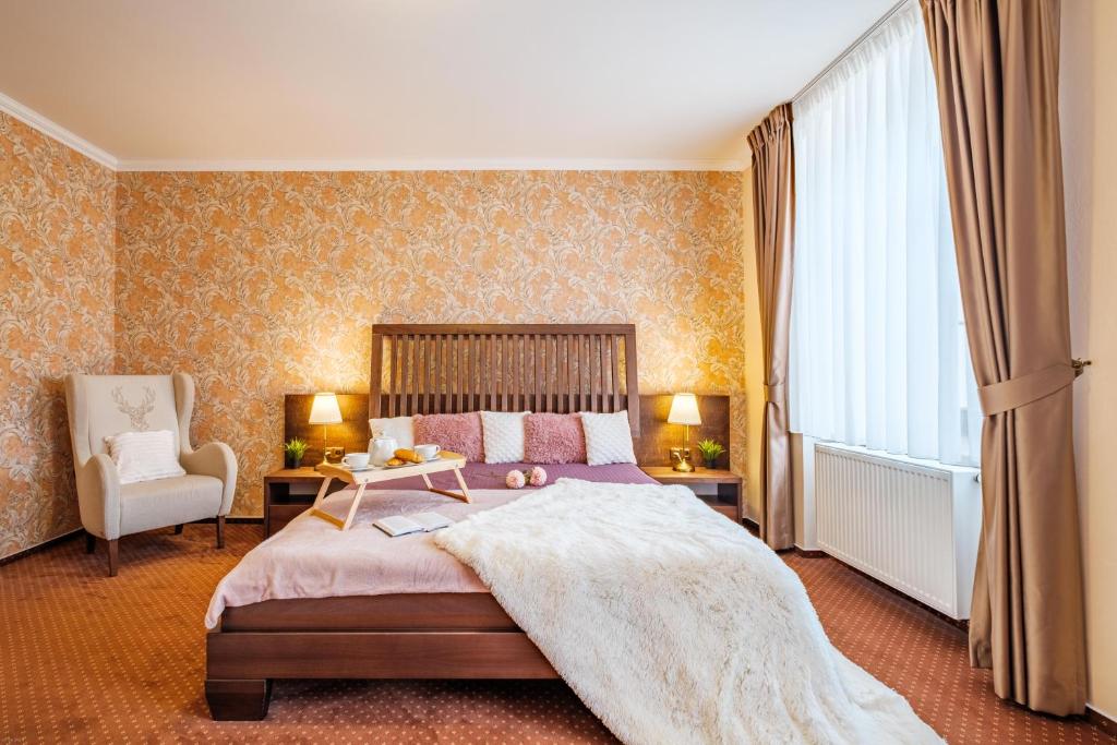 Łóżko lub łóżka w pokoju w obiekcie Hotel Orličan