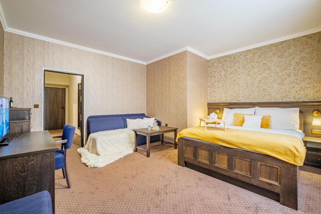 Łóżko lub łóżka w pokoju w obiekcie Hotel Orličan