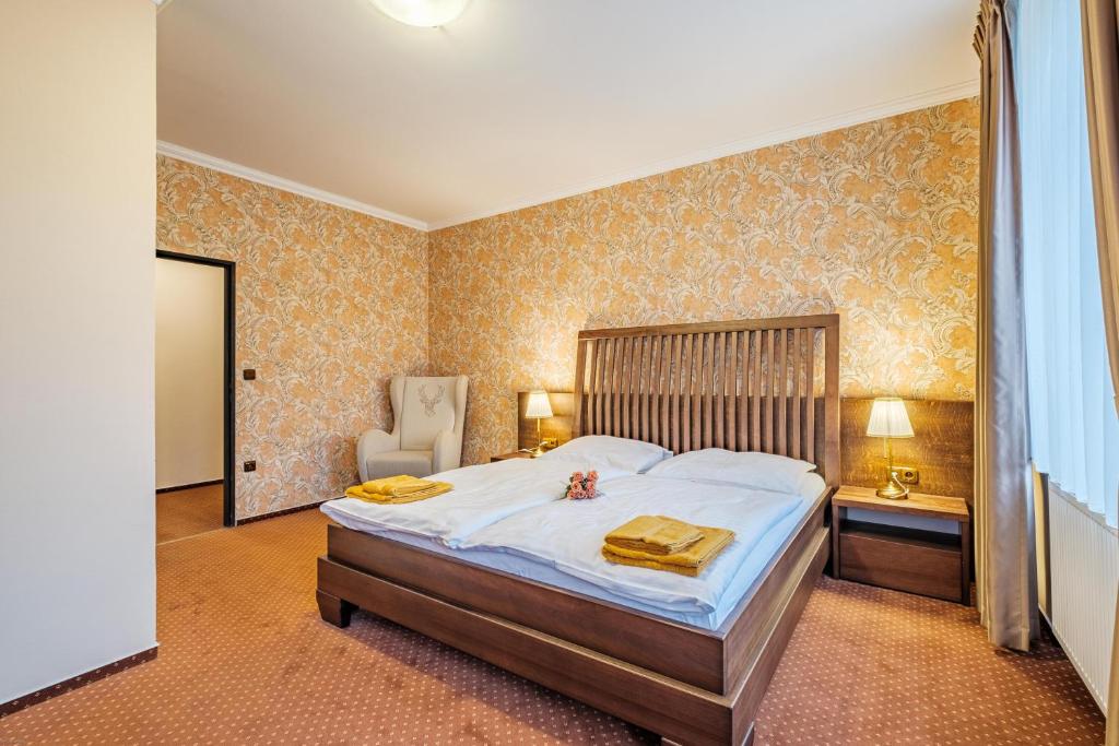 Łóżko lub łóżka w pokoju w obiekcie Hotel Orličan