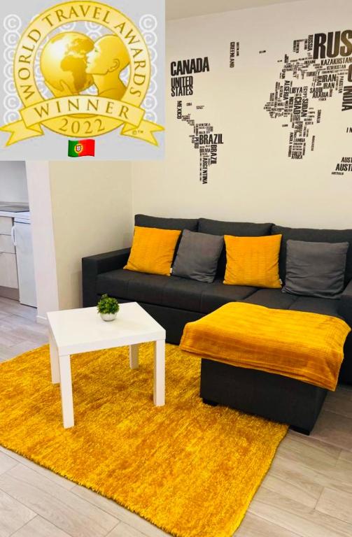 a living room with a couch and a table at Typical Lisbon center in Lisbon