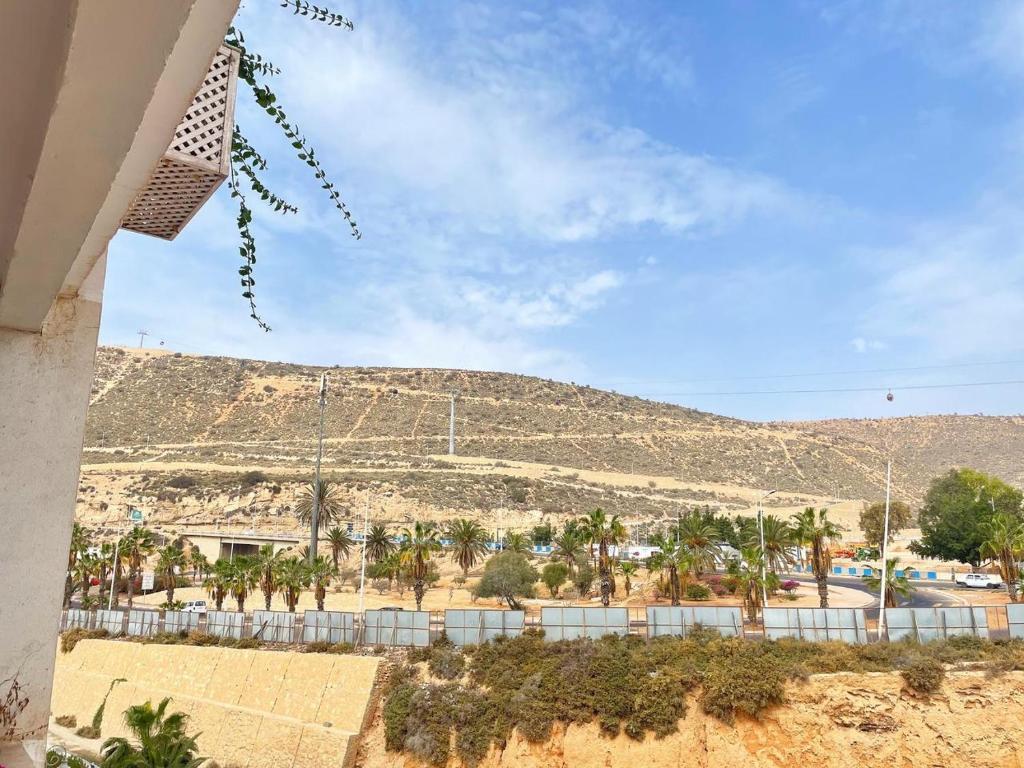 a view of a desert with a hill in the background at Best Apartment in Marina Agadir in Agadir