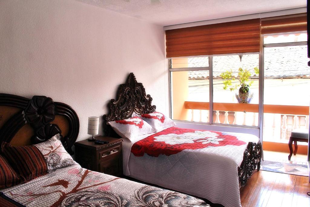 Postel nebo postele na pokoji v ubytování Chaska Hotel