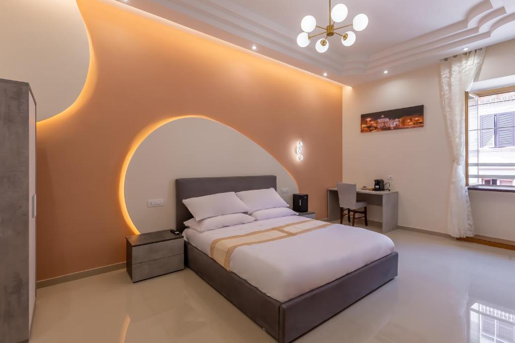 a bedroom with a bed and a table in it at Hyper Lodge Termini GuestHouse in Rome