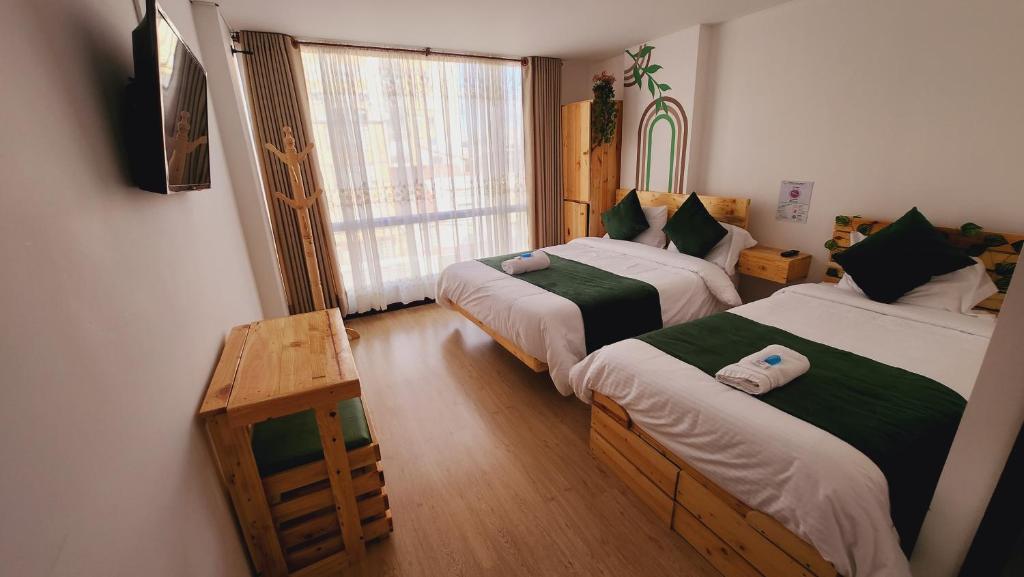 Postel nebo postele na pokoji v ubytování Hotel Natural Sevgi