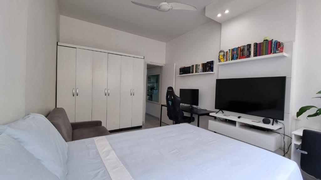 Кровать или кровати в номере Apartamento Temporada Copacabana