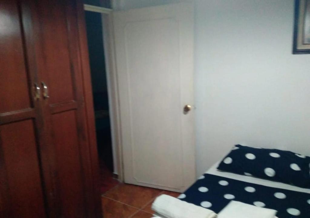 Voodi või voodid majutusasutuse Casa hotel Mi Huila toas