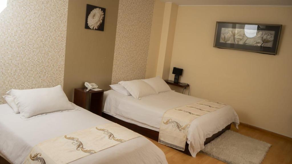 Postel nebo postele na pokoji v ubytování Hotel Ficoa