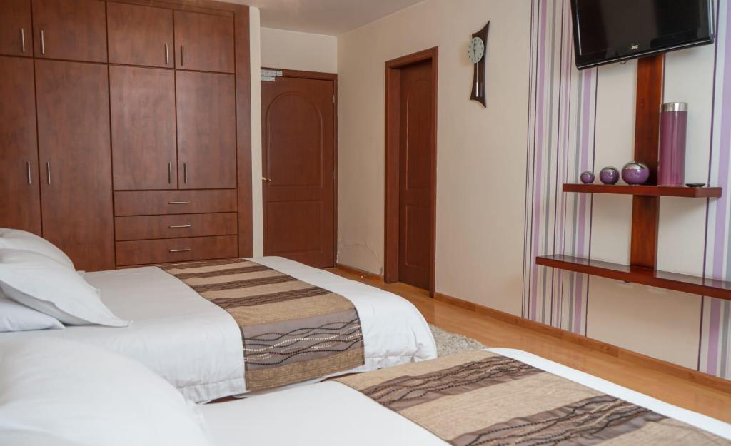 Postel nebo postele na pokoji v ubytování Hotel Ficoa
