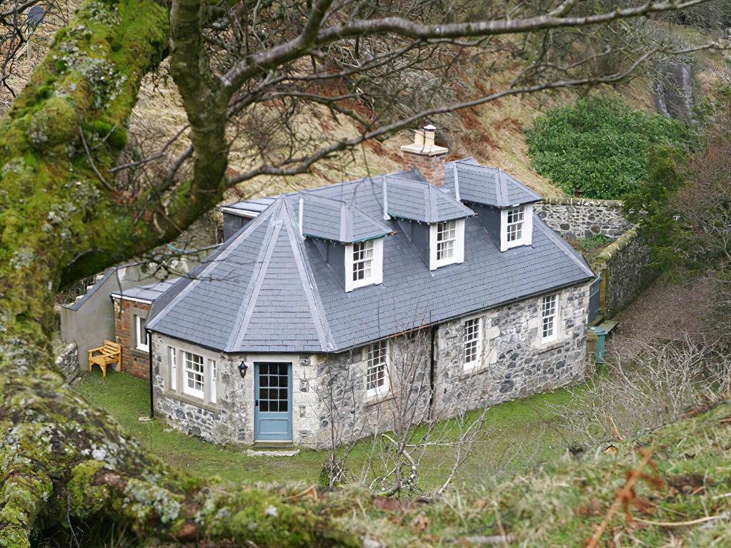 an old stone house with a gray roof at Find Me Out - Sccw in Dalmellington