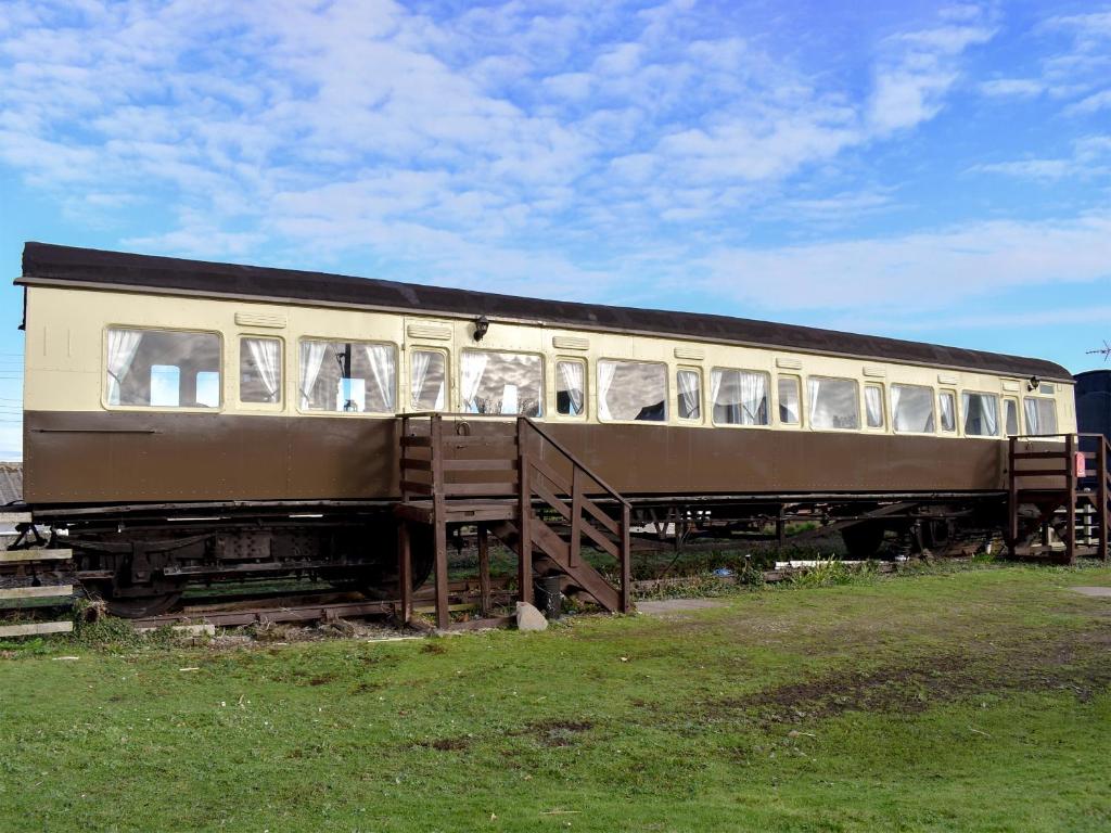 an old train car sitting on the tracks at Elsie in Blue Anchor