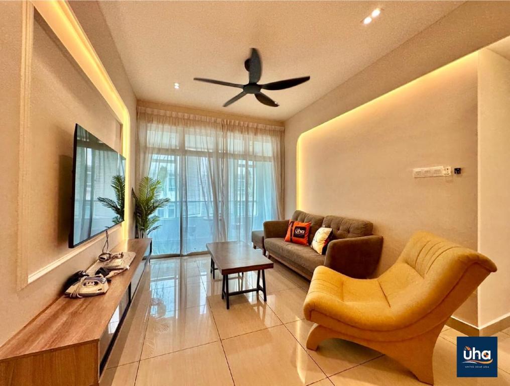 a living room with a couch and a ceiling fan at Midori Green By RR JBcity in Johor Bahru