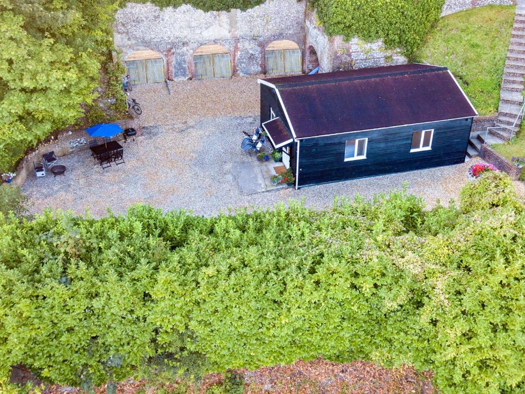 an overhead view of a black barn in a yard at Steyning Kilns in Steyning