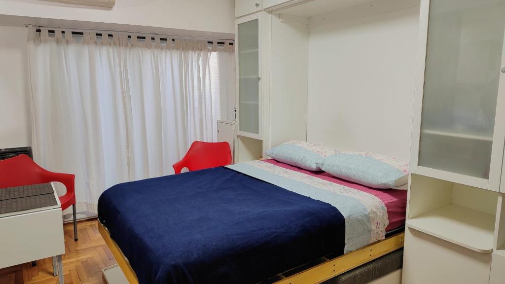 En eller flere senge i et værelse på Luminoso monoambiente en Monserrat