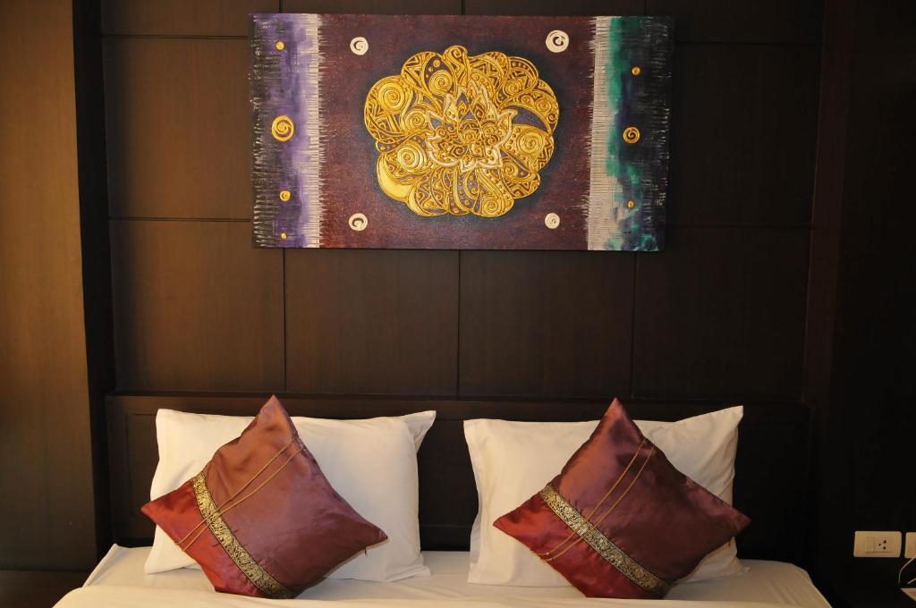 Postel nebo postele na pokoji v ubytování Regent Suvarnabhumi Hotel