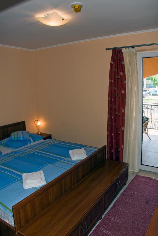 Postel nebo postele na pokoji v ubytování Korona Home