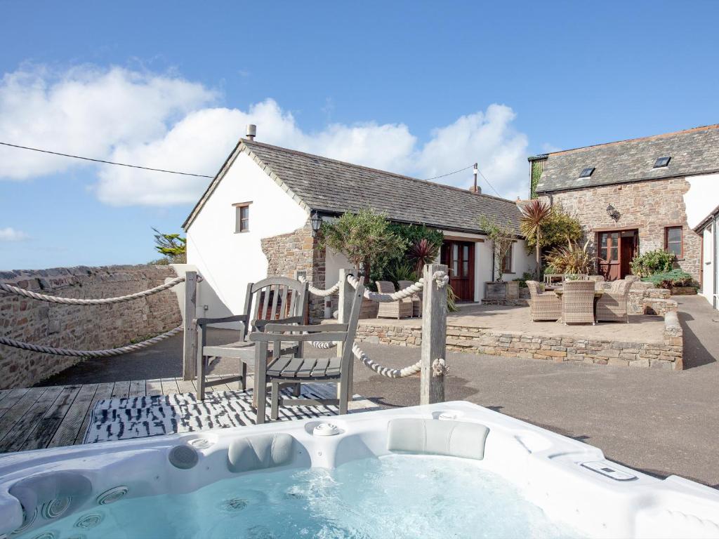 a house with a hot tub in front of it at Atlantic House in Bideford