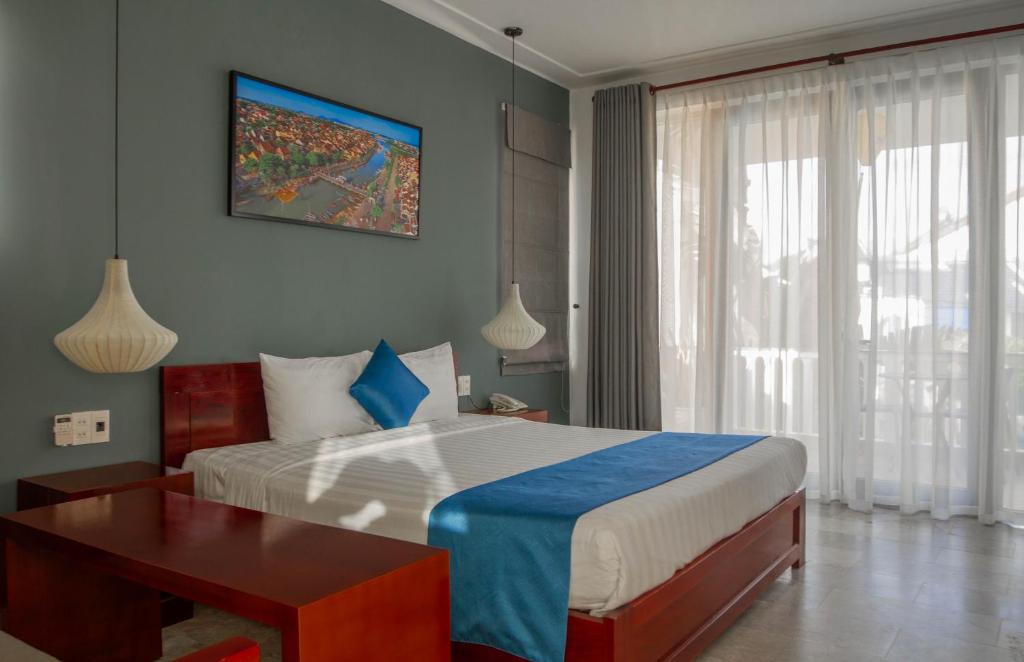 Postel nebo postele na pokoji v ubytování Hilary Boutique Villa Hội An