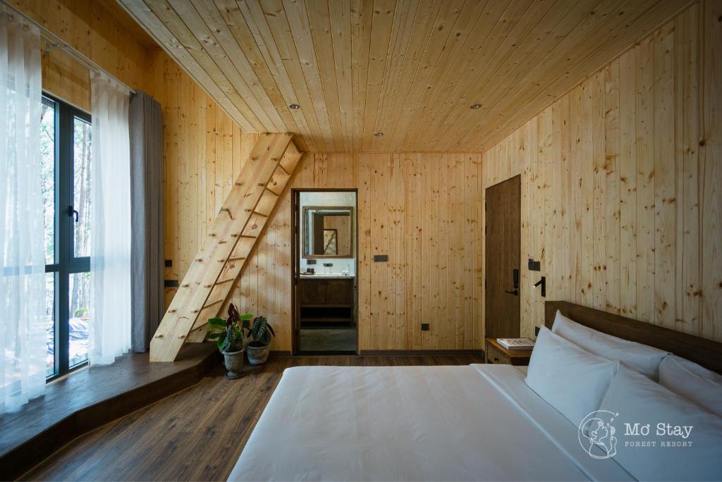 Giường trong phòng chung tại Mơ Stay - Forest Resort