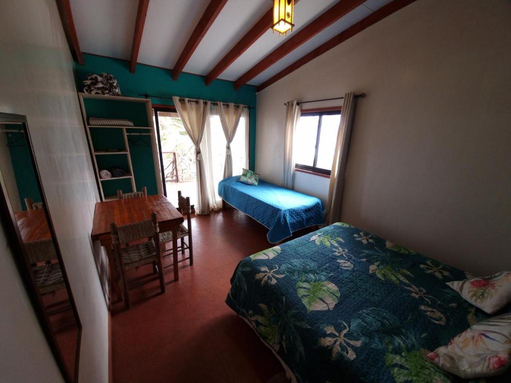 Postel nebo postele na pokoji v ubytování Hostal Vieroto