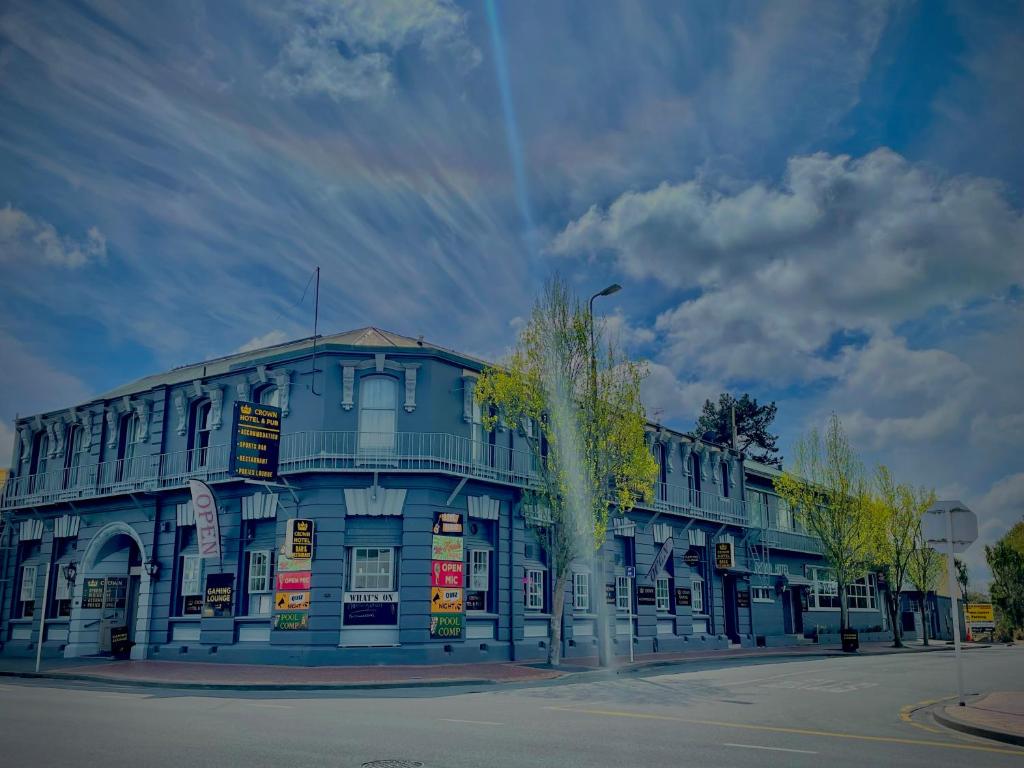 a blue building on the corner of a street at Geraldine Heritage Hotel in Geraldine