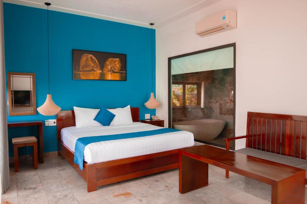 Postel nebo postele na pokoji v ubytování Hilary Boutique Villa Hội An