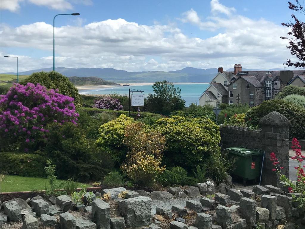 a view of the ocean from a garden at Apartment 6 harlech in Criccieth