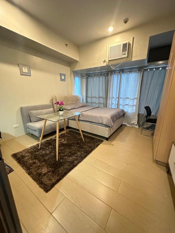 Ένα ή περισσότερα κρεβάτια σε δωμάτιο στο EJ's Staycation 4th F with 200mbps Wi-Fi and NETFLIX