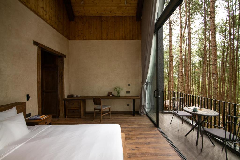 Giường trong phòng chung tại Mơ Stay - Forest Resort