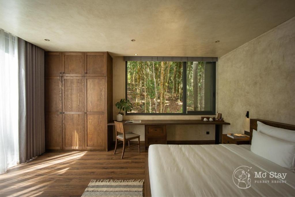 Giường trong phòng chung tại Mơ Stay - Forest Resort