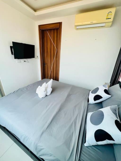 Postel nebo postele na pokoji v ubytování Arcadia Beach Resort Condo