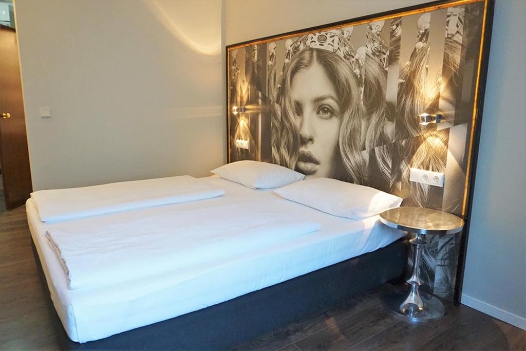 Postel nebo postele na pokoji v ubytování Hotel Calmo