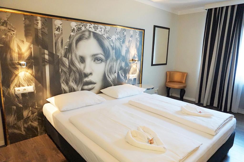 Postel nebo postele na pokoji v ubytování Hotel Calmo